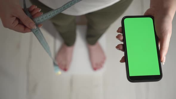 Young Woman Stands on White Electronic Scale