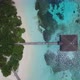 Aerial view of Maldives island, white sand and green palm trees and over water villas - VideoHive Item for Sale