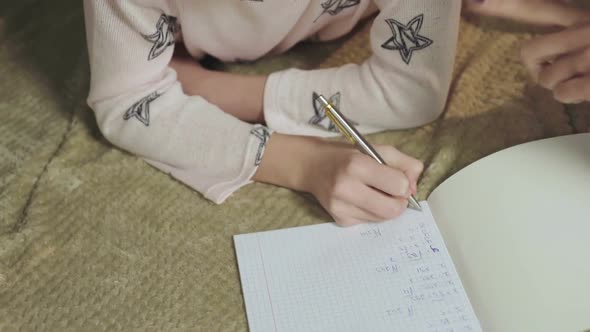 Smart Girl Solving Mathematical Equations in Bed Homeschooling Education