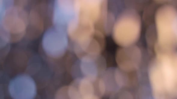 Golden Blurred Abstract Sparkles Lights. Bokeh Background