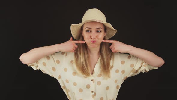 Funny Young Caucasian Blond Woman Touching Her Chicks with Index Fingers Over Black Background