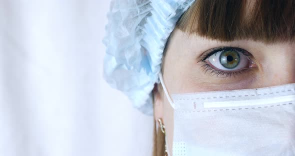 Portrait of a Close Up Woman Surgeon, Doctor With Mask Ready for Operation in Hospital or Clinic