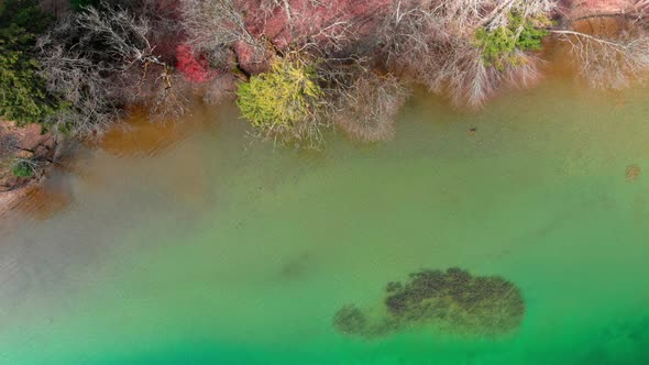 Top down aerial shot, stunning clear water of the Tegernsee with beautiful colors seen from above.