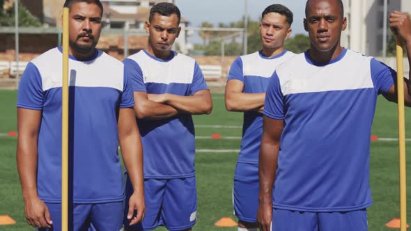 Soccer players standing on field