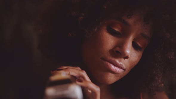 Woman With Afro Hair Using Vintage 8Mm Camera