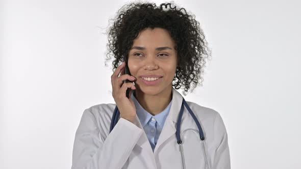 Portrait of African Female Doctor Talking on Smartphone in Office