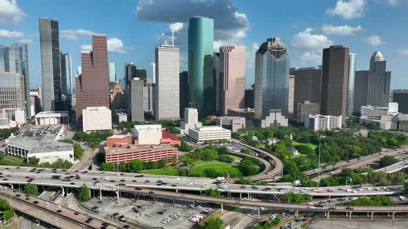Houston Texas urban city skyline on bright sunny day. Interstate 45 commuter traffic drives on freew