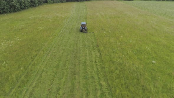 Tractor Mows the Grass