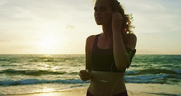 Athletic Young Woman Running at Sunset