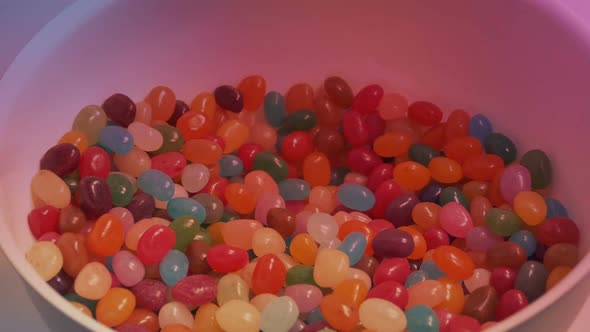 Man Takes Handful Of Jelly Beans At Party