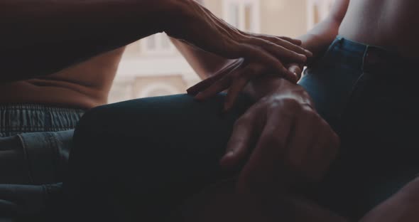 Close up of a boy gently kissing the arm of her girlfriend