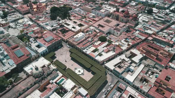 View of garden and church in downtown Queretaro in Mexico
