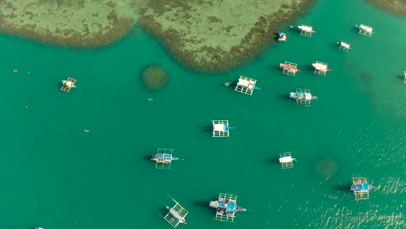 Tourist Boats in a Bay with Blue Water