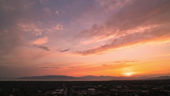 Moving timelapse at sunset overlooking Utah Valley past Orem City