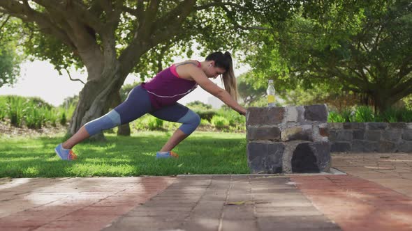 Caucasian woman working out in a park