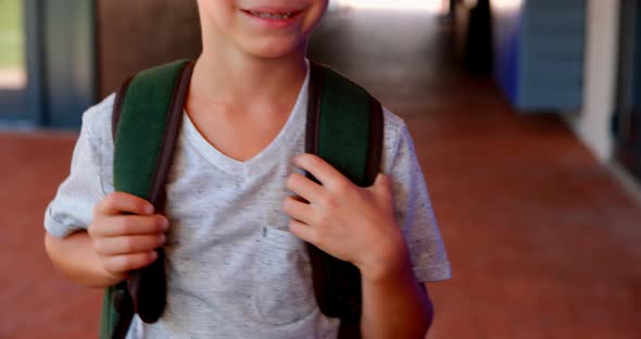 Portrait of cute schoolboy standing with backpack 4k