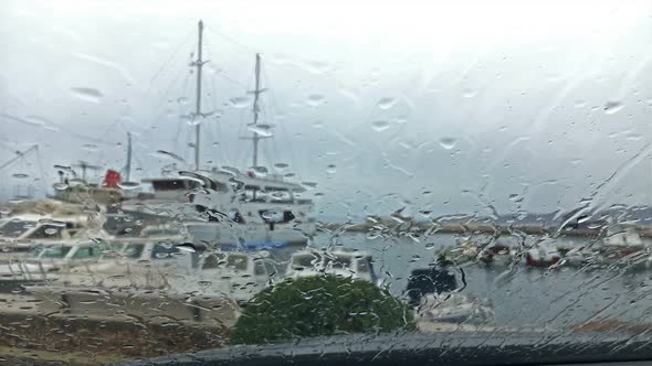 Rain Drops on Car Window Parked in Harbour