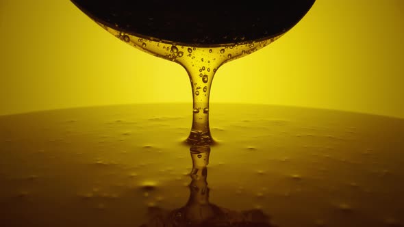 Honey Dripping Pouring From Spoon