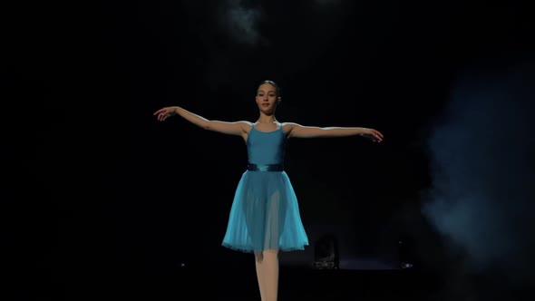 A Girl Performs an Attitude in a Ballet School