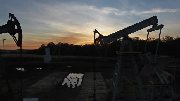 Flying Near Working Oil Pumps at Sunset