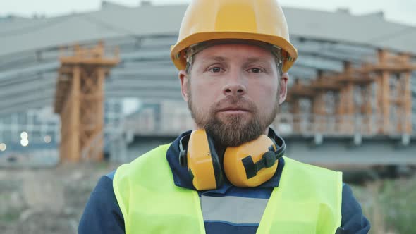 Portrait of Male Worker Posing on Construction Site