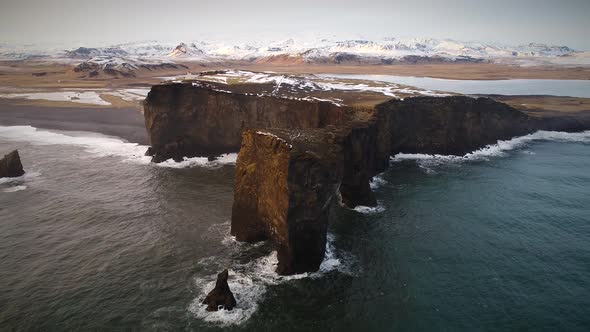 Aerial view of Dyrholaey peninsula with the black arch of lava.