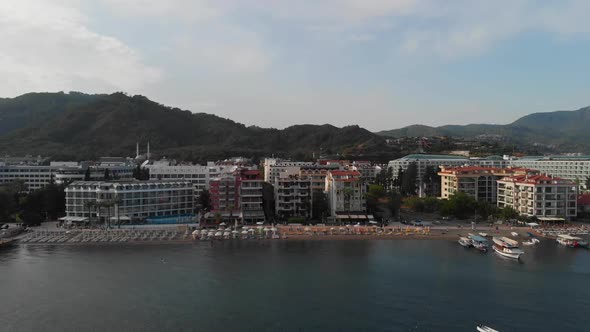 The Coastline of the Resort Town. The Camera Shoots the Beach of the Resort Town From the Sea Moving