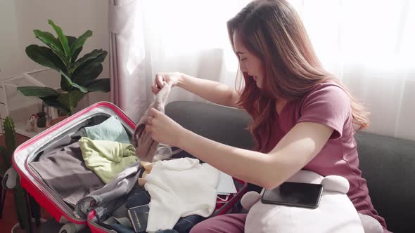 Woman serious checking before traveling the new normal travel need a face mask