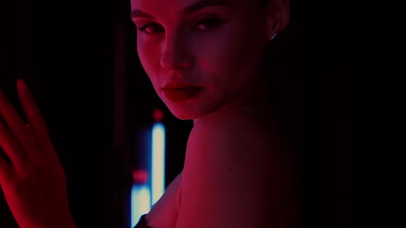 Sensual Woman Under Neon Illumination