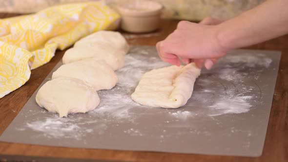 Woman makes homemade baguettes, Organic handmade baguette traditional french bread