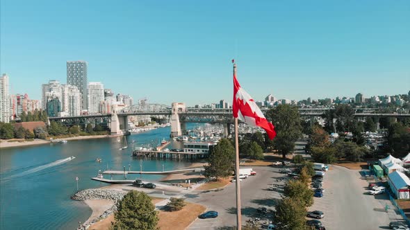 Canadian flag, Granville bridge, downtown vancouver, beach, boats.