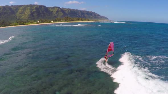 Aerial view of a man windsurfing in Hawaii