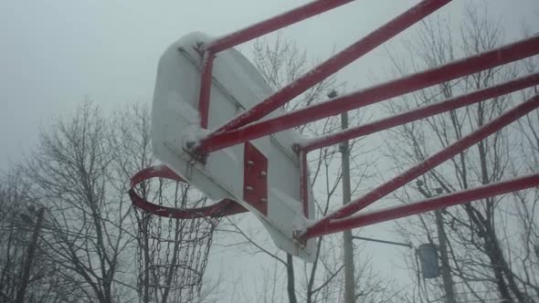 Basketball Net Covered with Snow