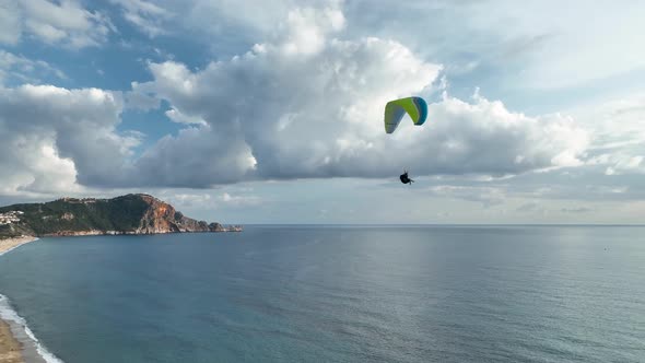 Aerial view 4 K parachute jumper flying over beautiful Alanya