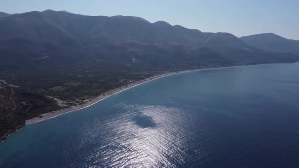 Beautiful Coastline of South Albania with Hills and Mountains Above Blue Azure Sea