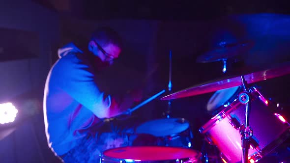 Drummer Playing Drums in the Nightclub