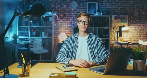 Time Lapse of Young Manager Working in Office at Desk Late in the Evening