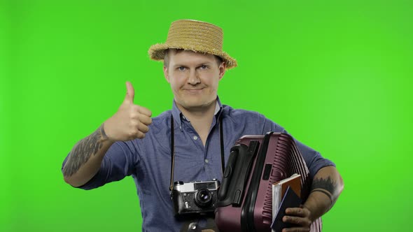 Portrait of Young Man Tourist Photographer Giving Thumbs Up. Chroma Key