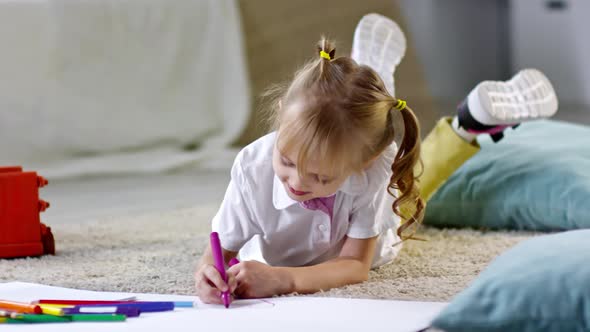 Girl Drawing with Felt Tip Pens