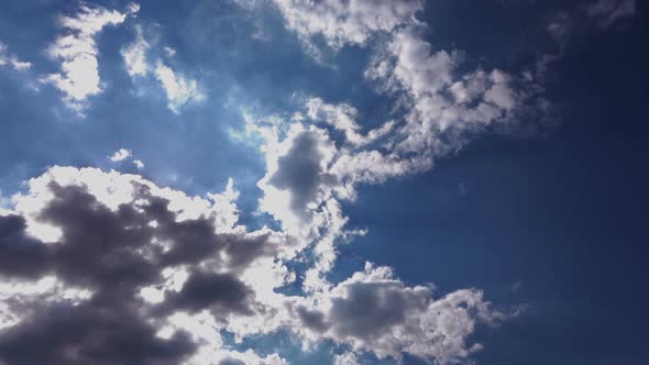 White Clouds Running Over Blue Sky