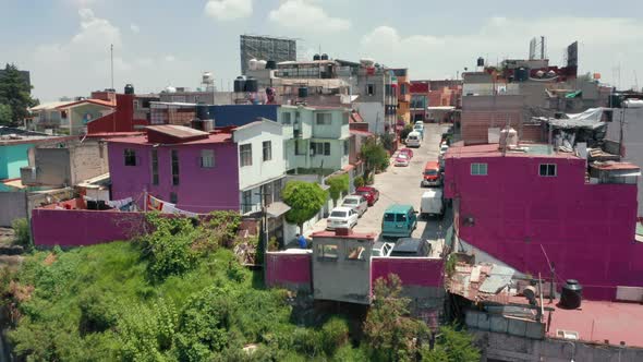 Mexico City Travel Destination. Pink Low-income Slum Building in Mexico Suburban