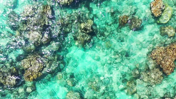 Luxury drone copy space shot of a white sandy paradise beach and aqua turquoise water background in 