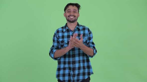 Happy Young Bearded Persian Hipster Man Clapping Hands