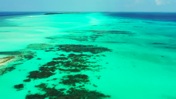 Aerial above sky of relaxing tourist beach time by blue ocean and white sand background of a dayout 