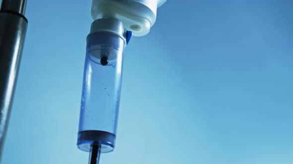 Close-up Shot of Medical Dropper with Dripping Medicine. Drug, Death.