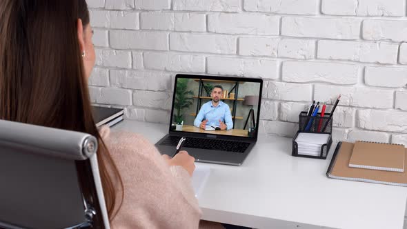 Man tutor in computer screen greets talk teaches by remote webcam, distance education