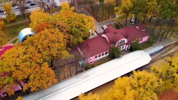 Aerial railway station in yellow autumn forest