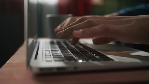 Close Up of Black African Business Man Hands Working Using Keyboard of Computer Laptop Teenager or