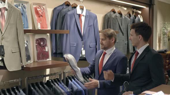 Friends in Suits Shopping in Menswear Clothing Store