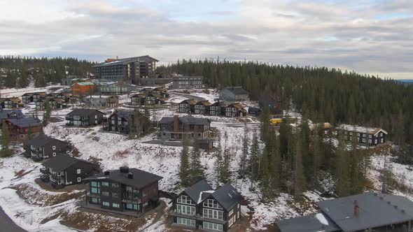 Åre, Sweden. Winterscape Ski Resort Buildings in Snowy Alpine Mountain Forest.